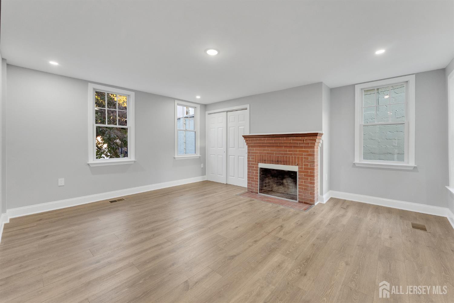 15 North Main Street, Unit A Pennington, NJ 08534 - Photo 4 of 9 a view of an empty room with a window and fireplace