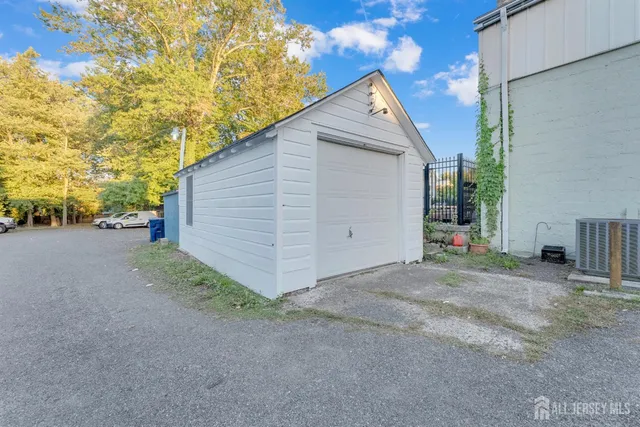 a view of a house with a yard and garage