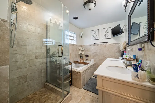 a bathroom with a sink and a shower