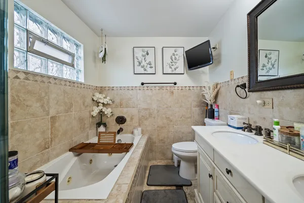 a bathroom with a sink a toilet and a bathtub