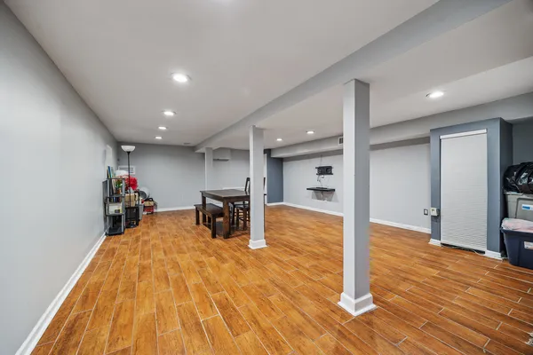 a view of a room with wooden floor gaming appliances