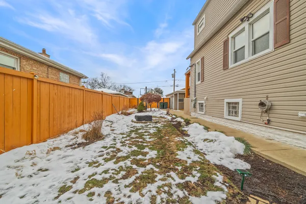 a view of a backyard of the house