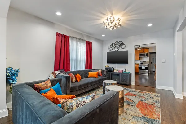a living room with furniture and a flat screen tv