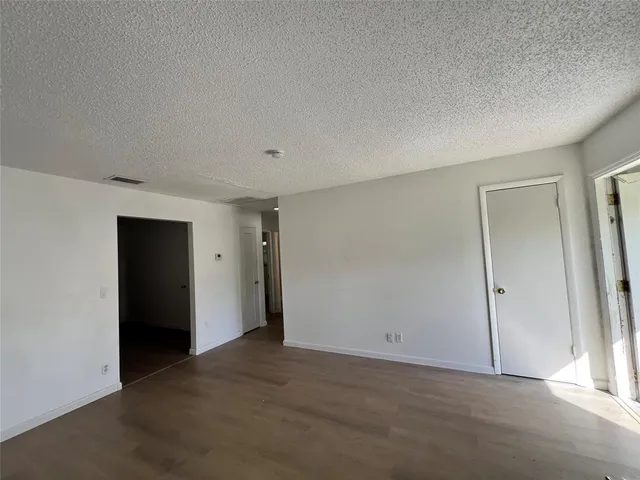 an empty room with closet area