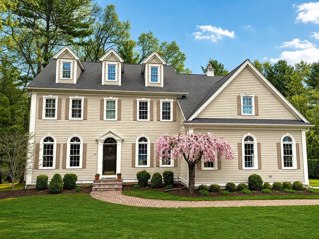 65 Deerpath Road Dedham, MA 02026 - Photo 1 of 38 a front view of a house with a yard