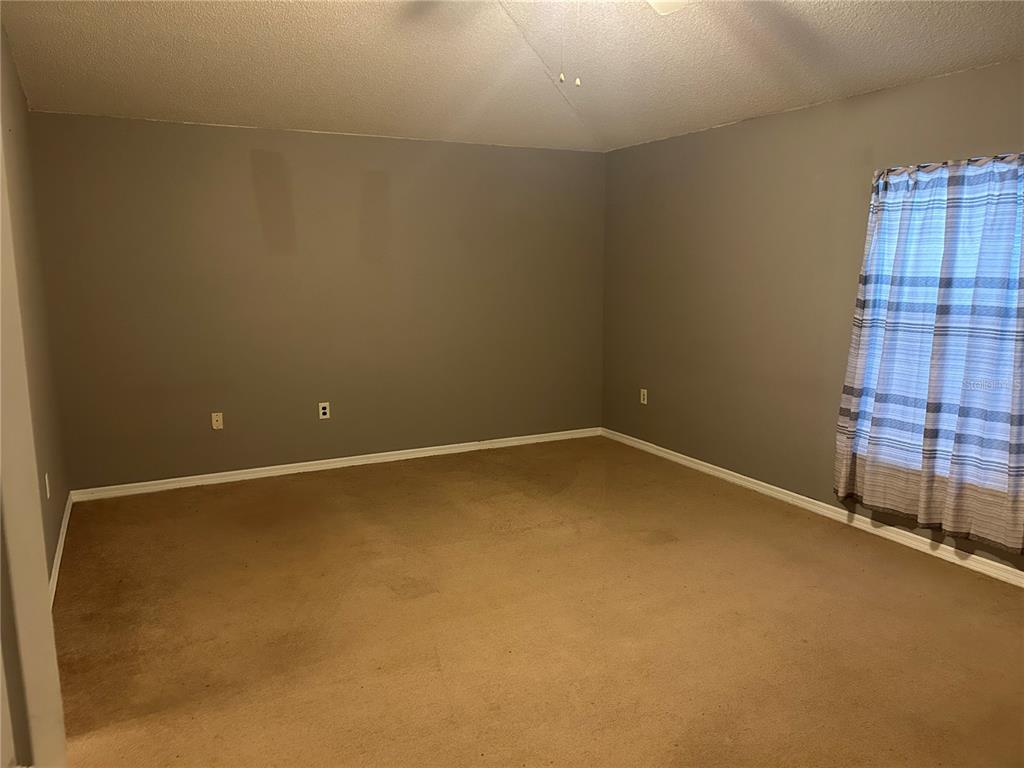 706 Hawk Lane Kissimmee, FL 34759 - Photo 4 of 9 a view of an empty room