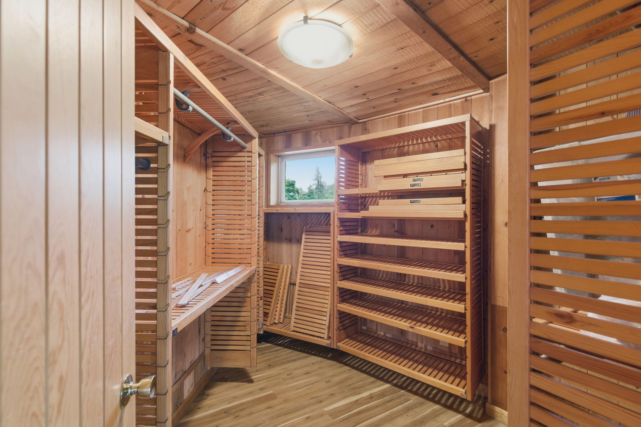 9595 Sterling Creek Road Jacksonville, OR 97530 - Photo 25 of 76 a view of walk in closet with empty racks