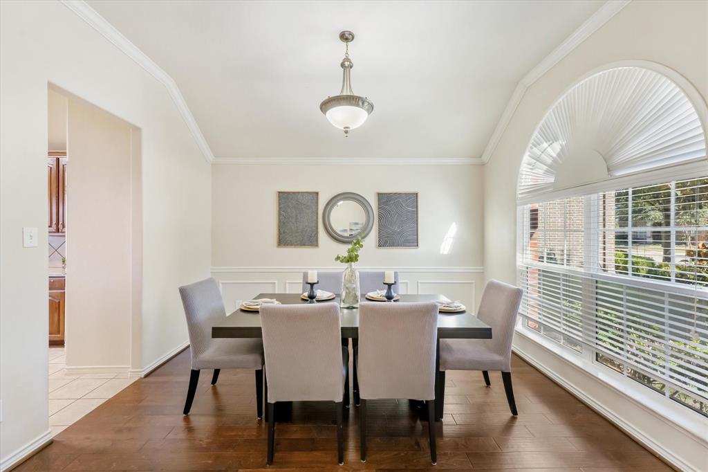 12811 Greenhaven Drive Frisco, TX 75035 - Photo 6 of 28 a view of a dining room with furniture window and wooden floor