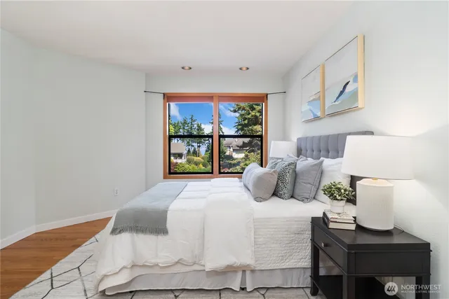 a bedroom with a bed and a window