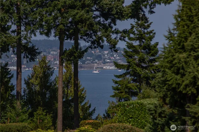 an aerial view of house with yard and outdoor seating