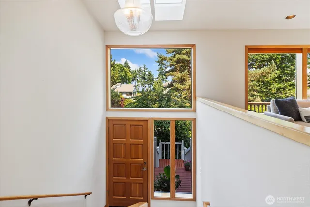 a view of a room that has a bed and a window