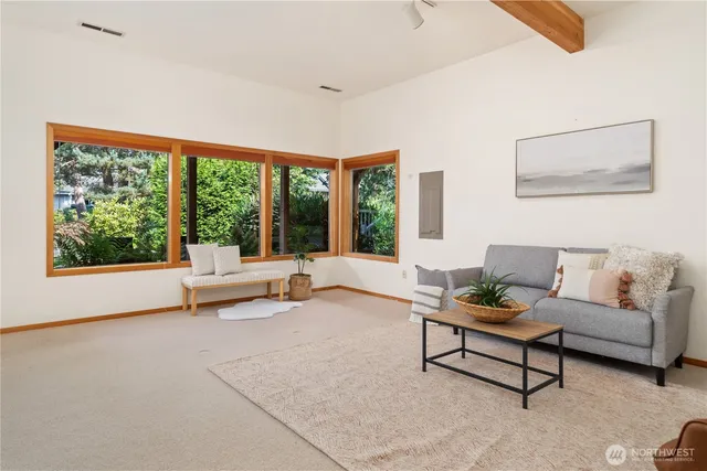 a living room with furniture and a chair