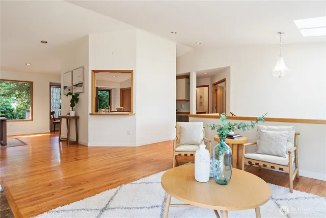 a dining room with furniture and wooden floor