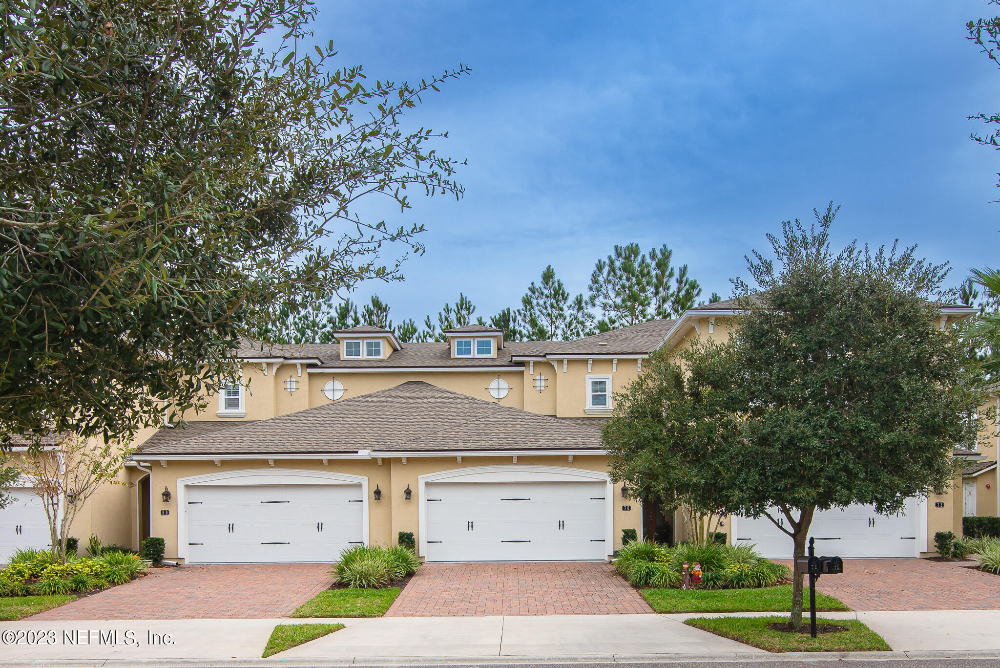 76 Oyster Bay Way Ponte Vedra, FL 32081 - Photo 1 of 28 a front view of a house with a yard garage and outdoor seating