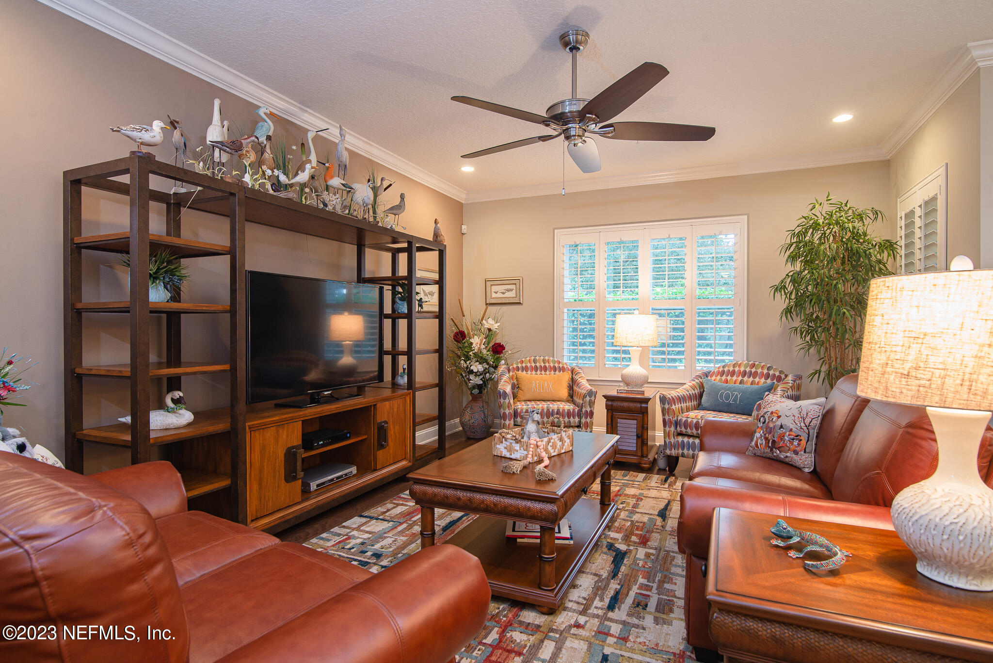 76 Oyster Bay Way Ponte Vedra, FL 32081 - Photo 14 of 28 a living room with furniture a window and a flat screen tv