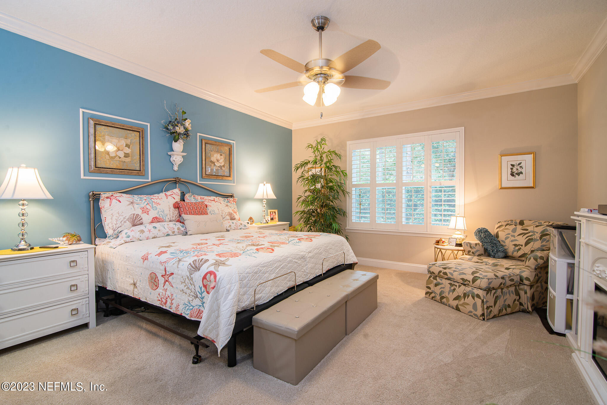 76 Oyster Bay Way Ponte Vedra, FL 32081 - Photo 16 of 28 a spacious bedroom with a bed and a chandelier