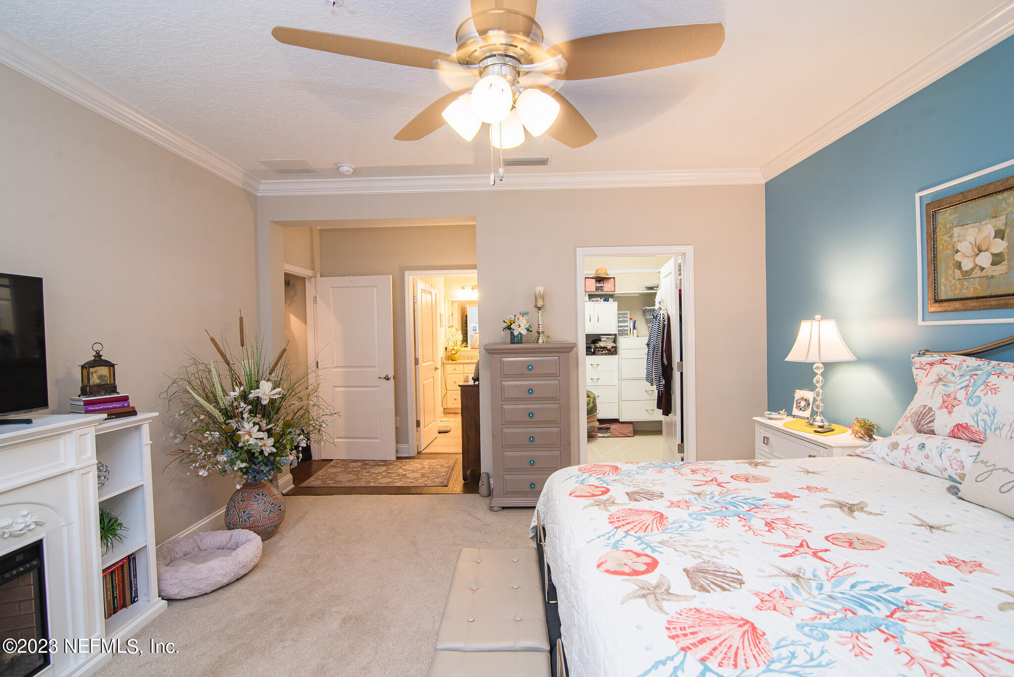 76 Oyster Bay Way Ponte Vedra, FL 32081 - Photo 17 of 28 a bedroom with a bed potted plant with the dresser and mirror