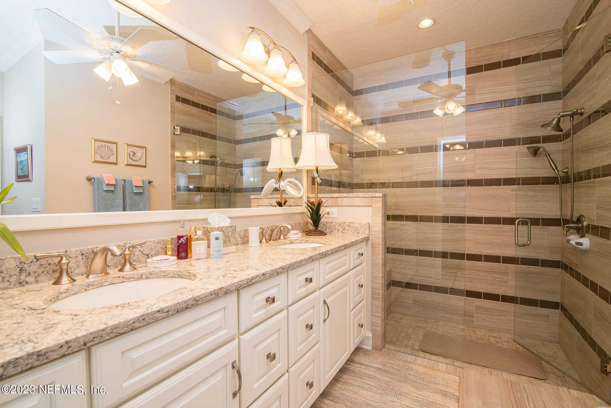 76 Oyster Bay Way Ponte Vedra, FL 32081 - Photo 18 of 28 a bathroom with double vanity and a mirror