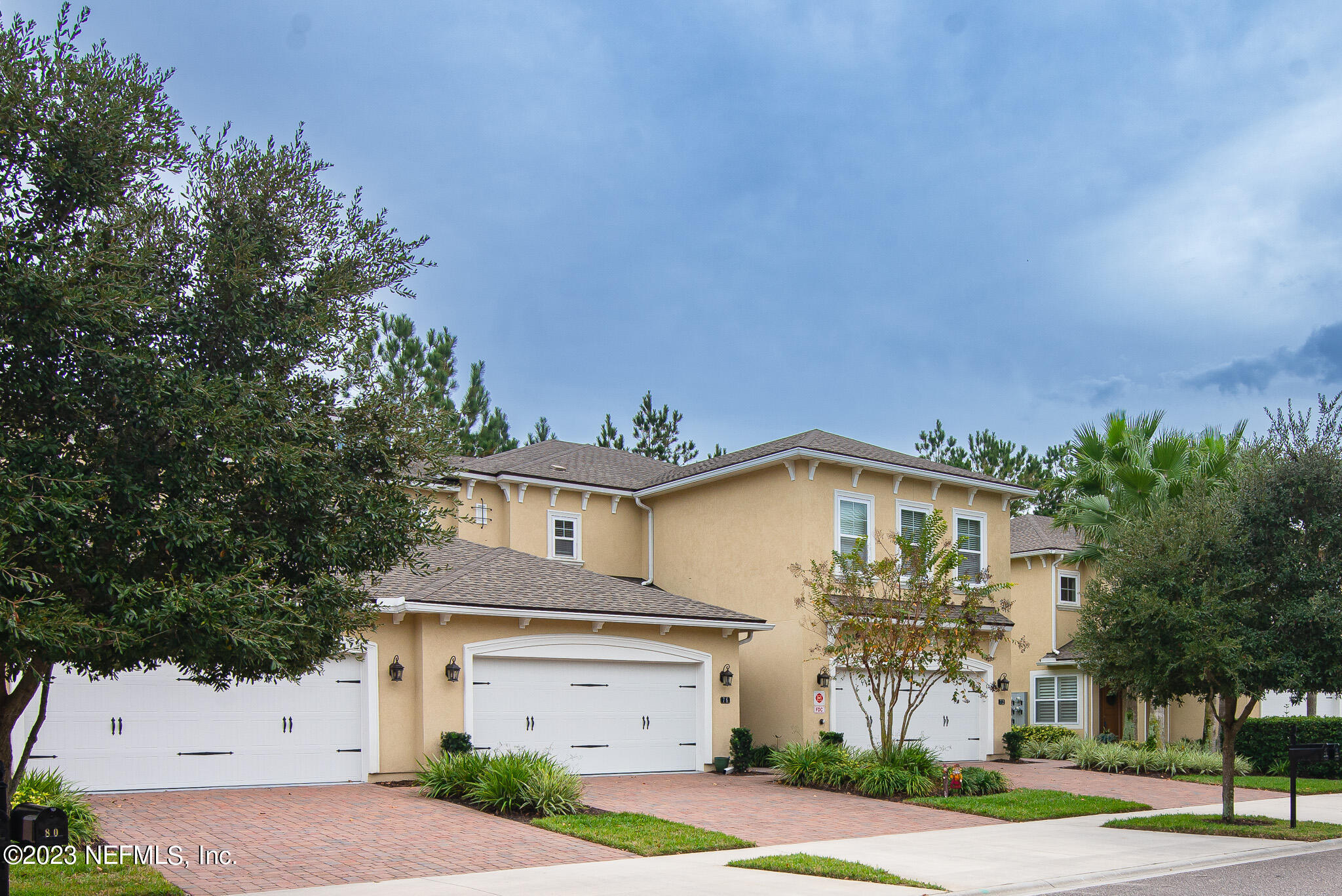 76 Oyster Bay Way Ponte Vedra, FL 32081 - Photo 2 of 28 a front view of a house with a yard and garage