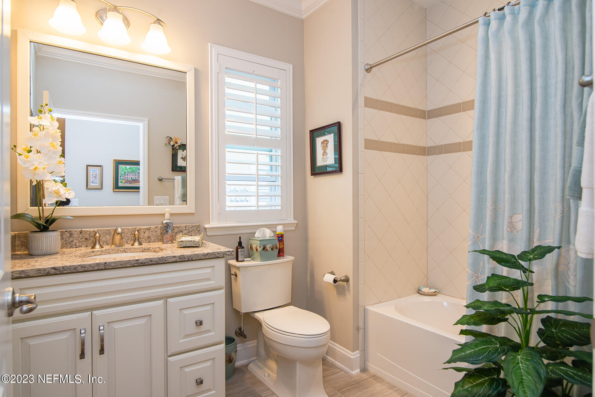 76 Oyster Bay Way Ponte Vedra, FL 32081 - Photo 23 of 28 a bathroom with a sink a toilet a mirror and shower