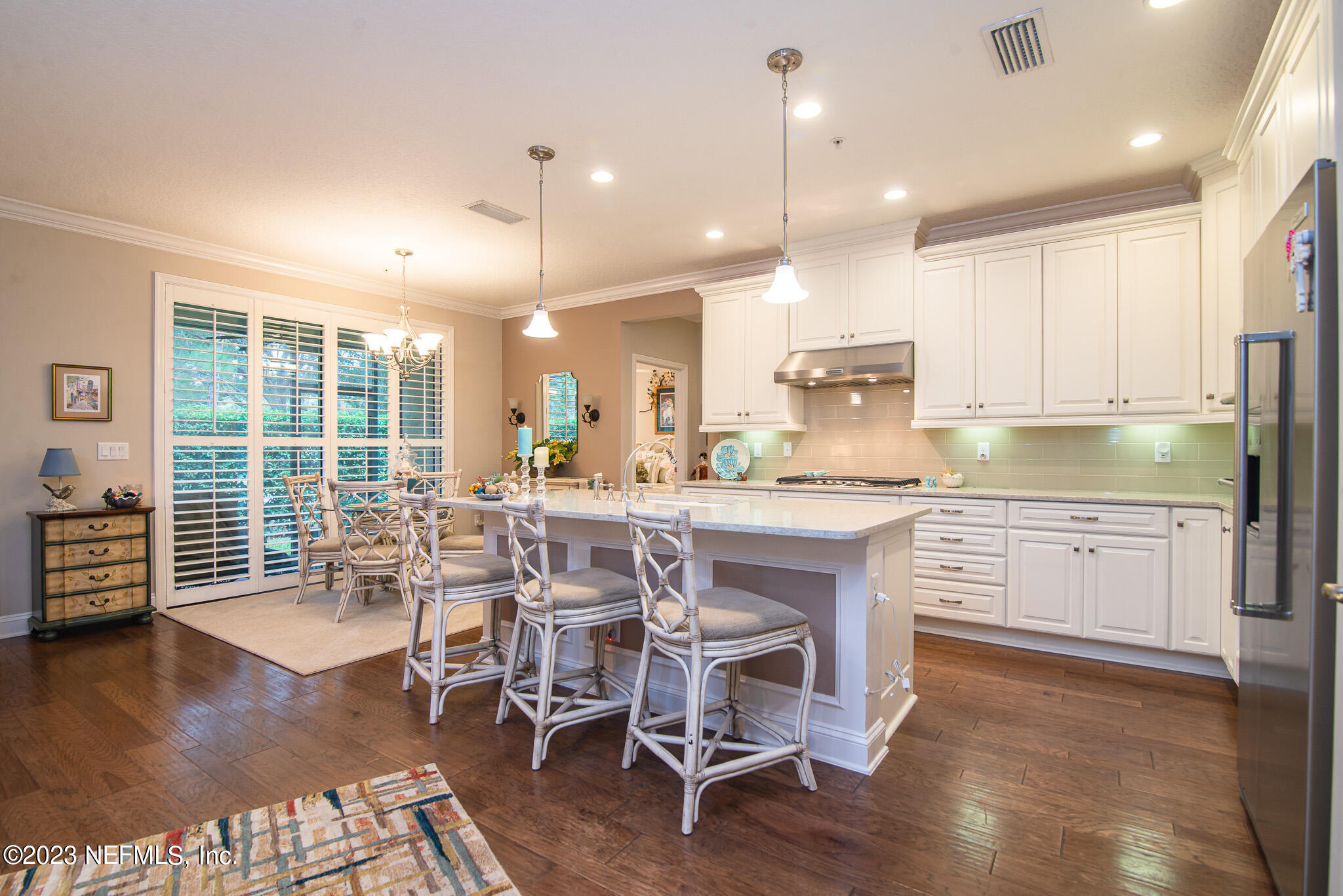 76 Oyster Bay Way Ponte Vedra, FL 32081 - Photo 10 of 28 a large kitchen with a table and chairs