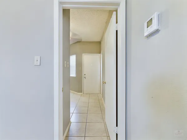 a view of an empty room with a bathroom