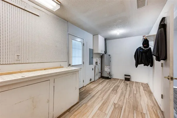 a view of a house with backyard and a patio