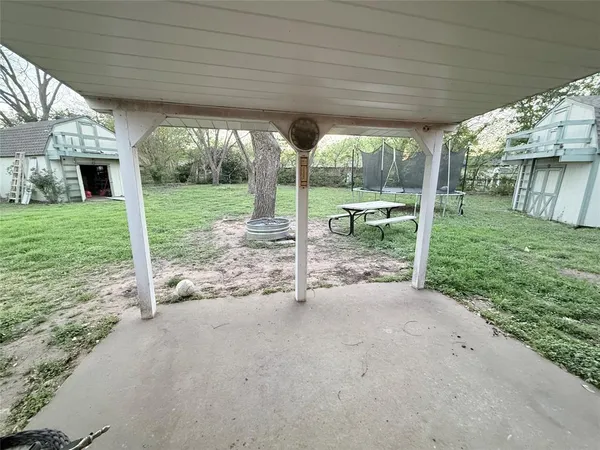 a view of a room with a sink and backyard
