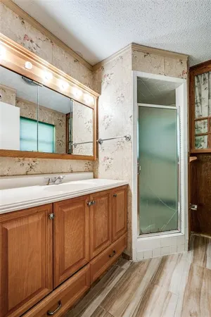 a view of a livingroom with a window and a ceiling fan