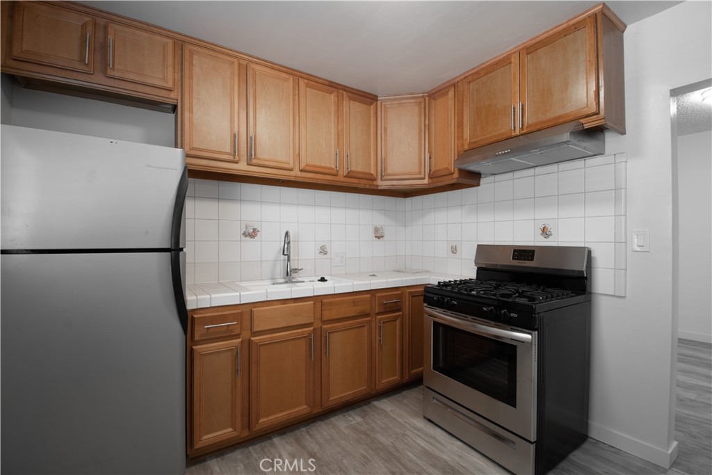 906 East Imperial Avenue El Segundo, CA 90245 - Photo 4 of 21 a kitchen with stainless steel appliances granite countertop a stove a sink and a refrigerator