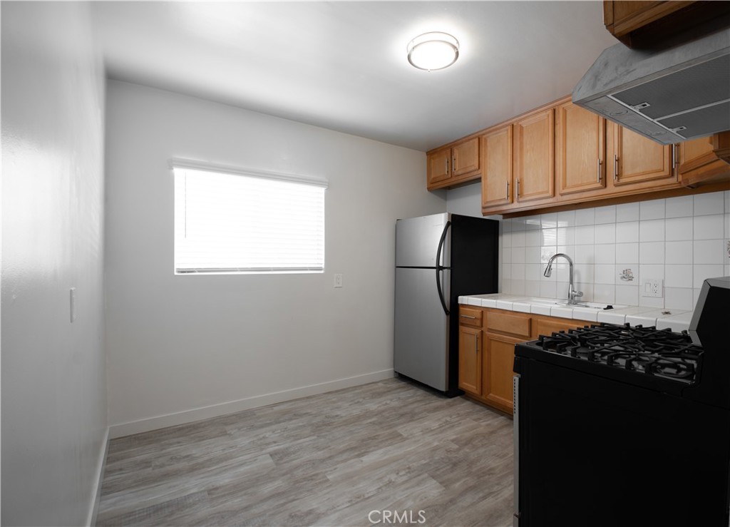 906 East Imperial Avenue El Segundo, CA 90245 - Photo 5 of 21 a kitchen with a refrigerator and a sink