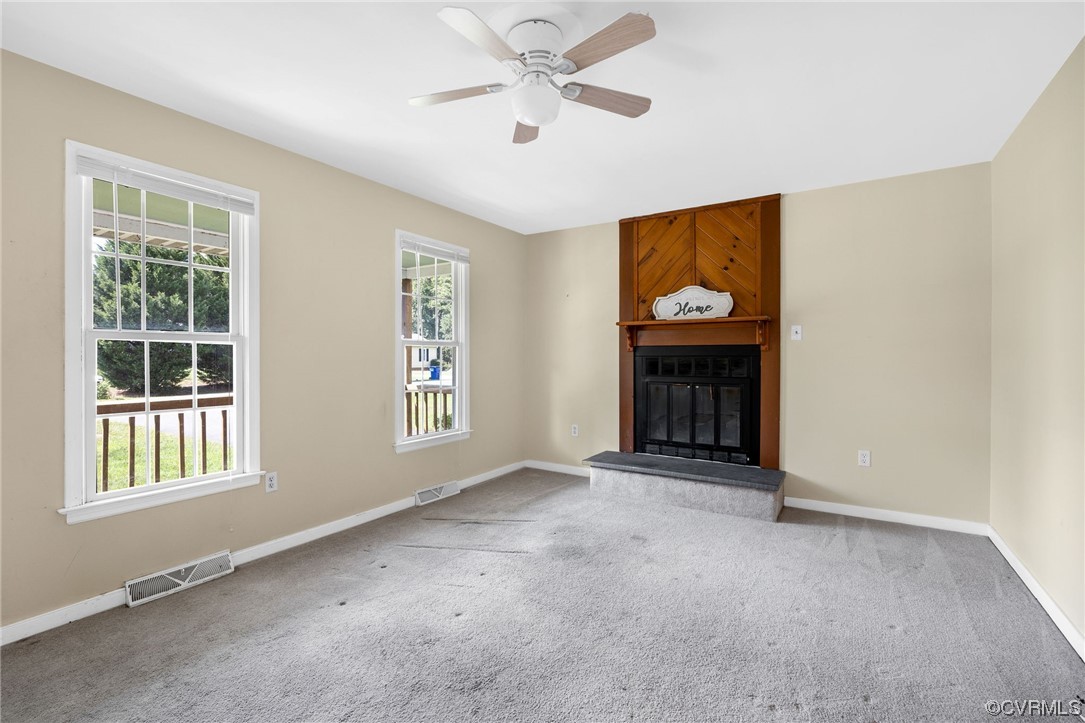 4841 Wilconna Road Chesterfield, VA 23832 - Photo 14 of 34 a view of an empty room with chandelier fan and window