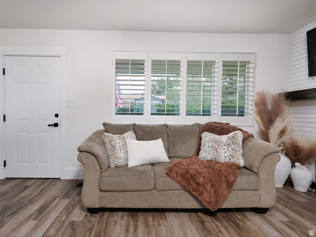8252 Wood Street Midvale, UT 84047 - Photo 11 of 40 Bright interior space featuring white walls and wood-finish flooring