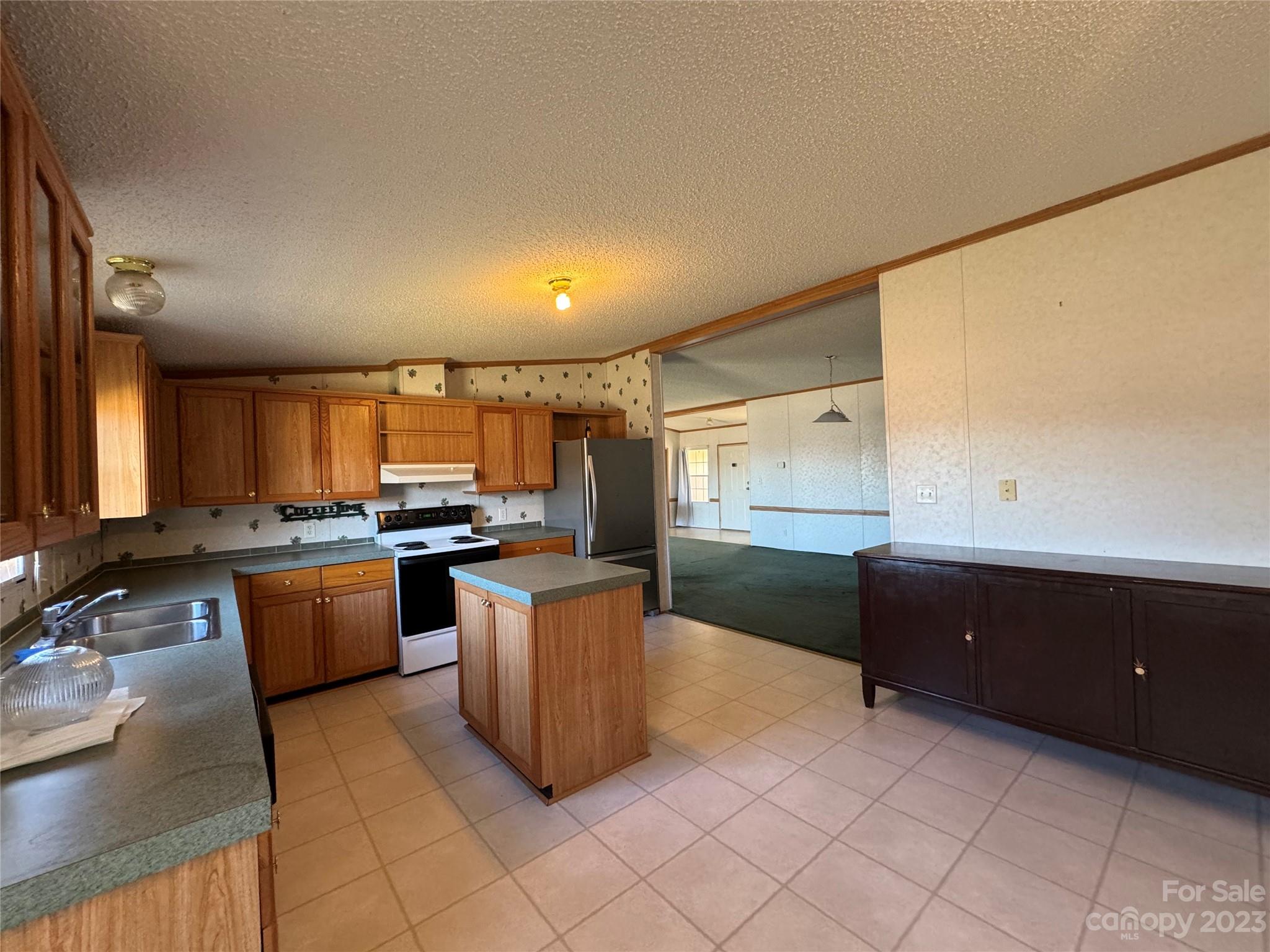 648 Ike Lynch Road Dallas, NC 28034 - Photo 13 of 32 a kitchen with stainless steel appliances granite countertop a sink and cabinets