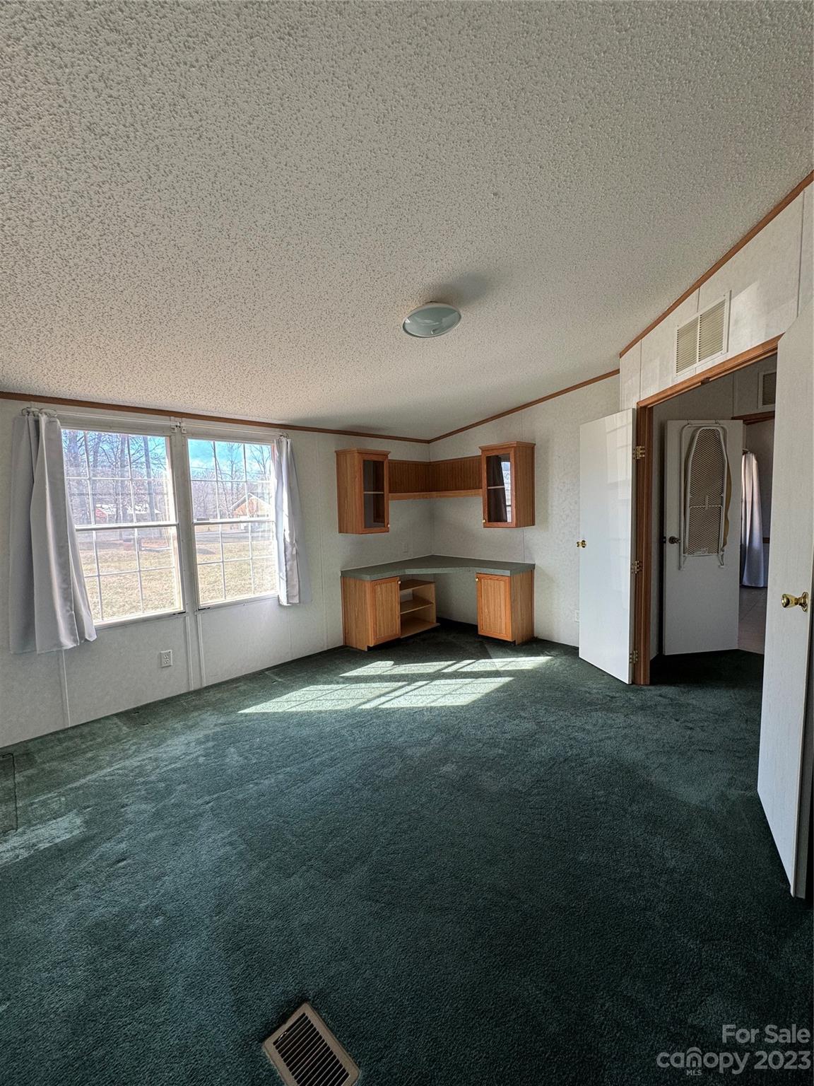 648 Ike Lynch Road Dallas, NC 28034 - Photo 19 of 32 a view of empty room with windows