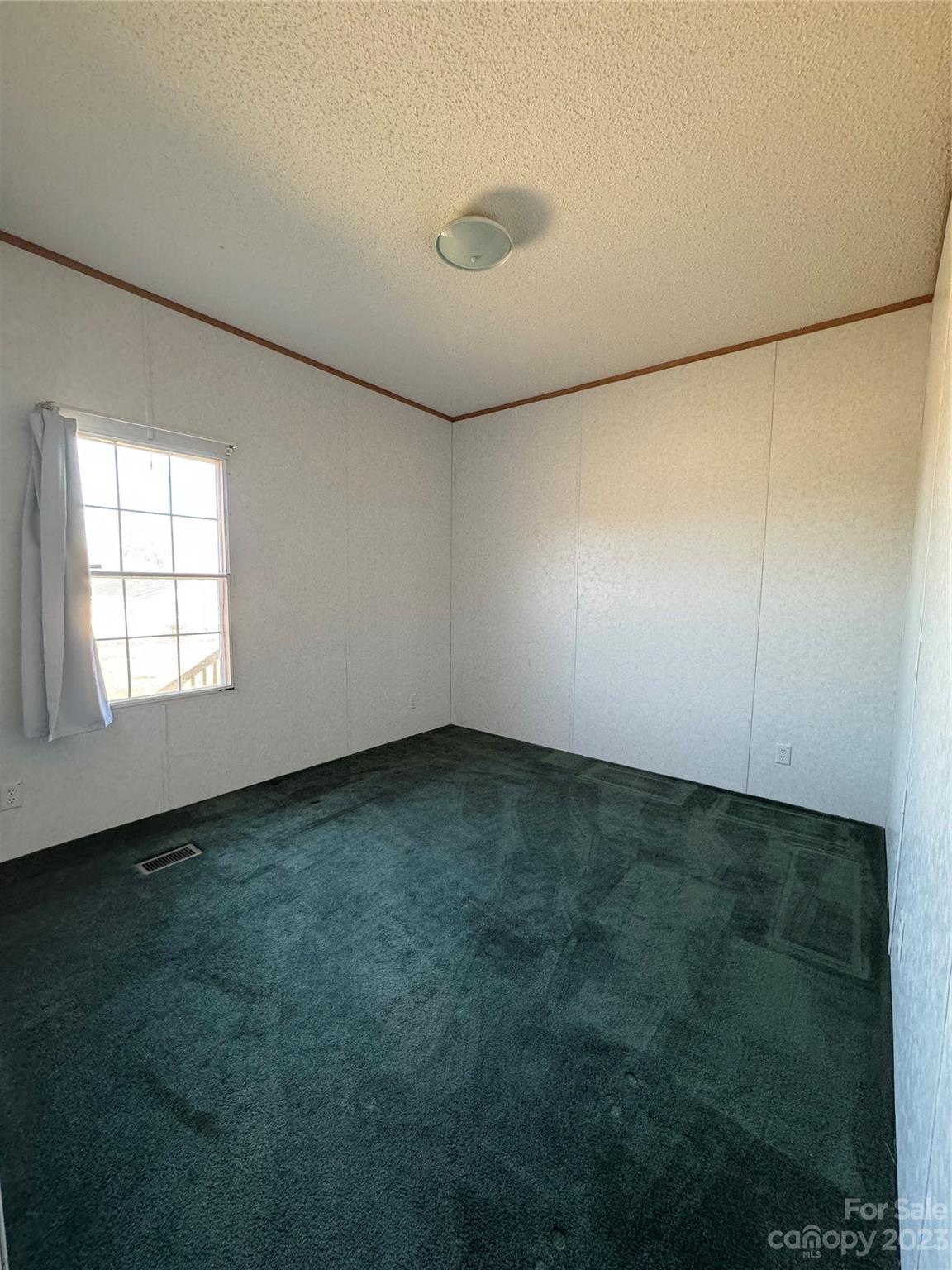 648 Ike Lynch Road Dallas, NC 28034 - Photo 22 of 32 an empty room with a empty space and windows
