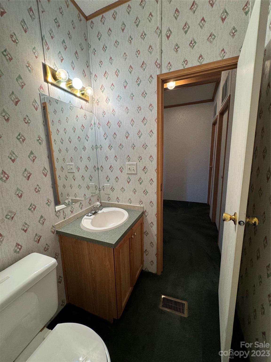 648 Ike Lynch Road Dallas, NC 28034 - Photo 24 of 32 a bathroom with a sink a toilet a mirror and shower