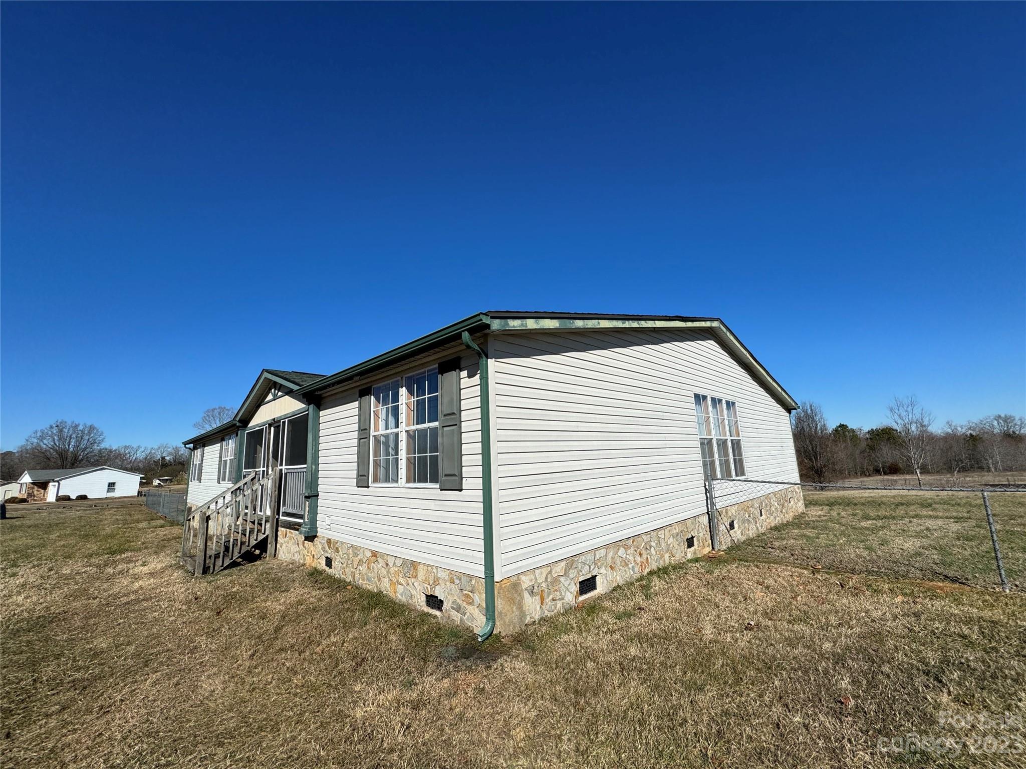 648 Ike Lynch Road Dallas, NC 28034 - Photo 27 of 32 a view of a house with a backyard
