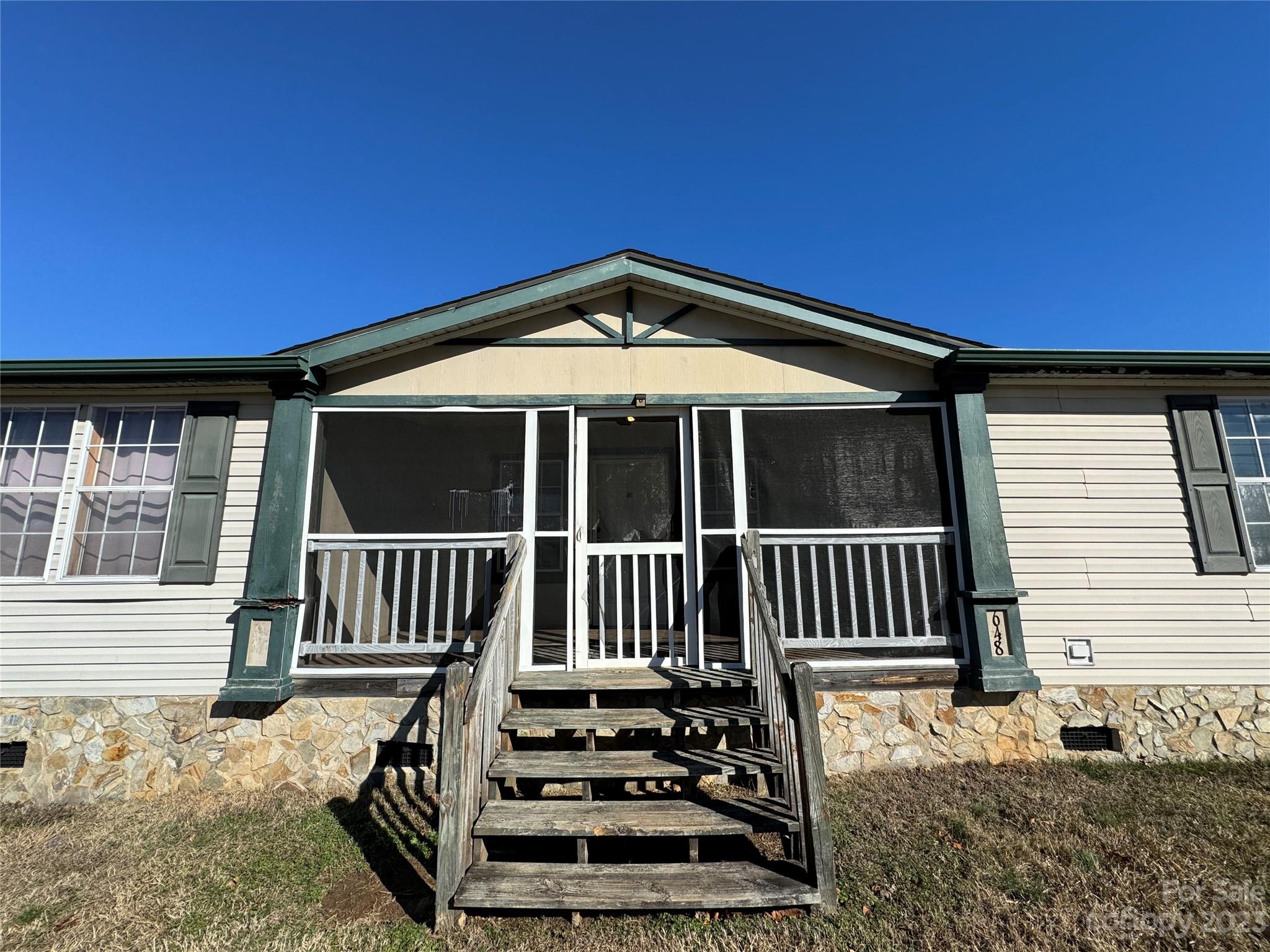 648 Ike Lynch Road Dallas, NC 28034 - Photo 28 of 32 a view of a house with wooden deck