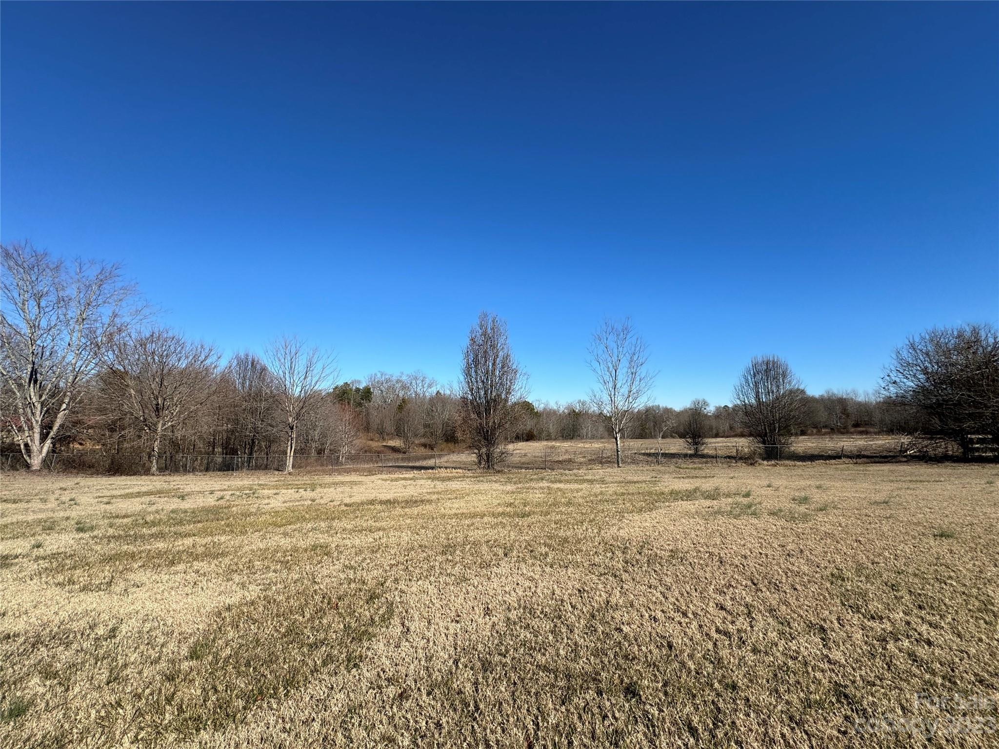 648 Ike Lynch Road Dallas, NC 28034 - Photo 31 of 32 a view of a lake with a yard