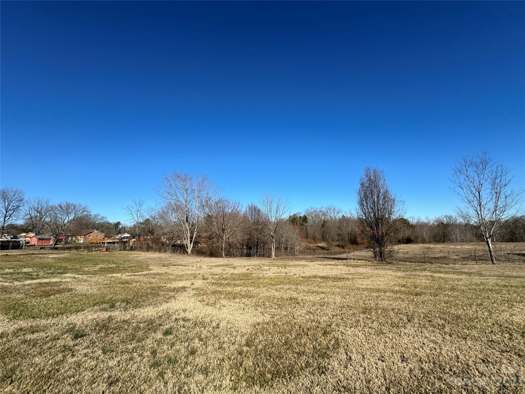 648 Ike Lynch Road Dallas, NC 28034 - Photo 32 of 32 a view of a field with trees