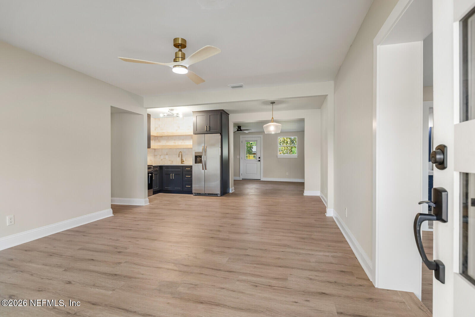2614 Leonid Road Jacksonville, FL 32218 - Photo 4 of 24 a view of a kitchen with a sink and a refrigerator