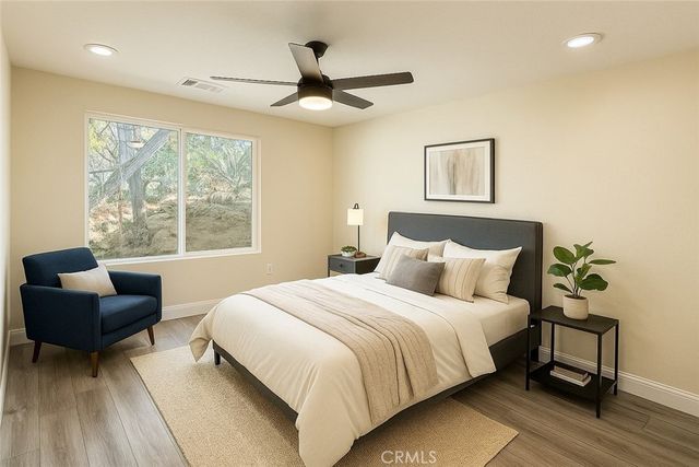 a bedroom with a bed and a couch