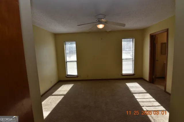 a view of an empty room and window