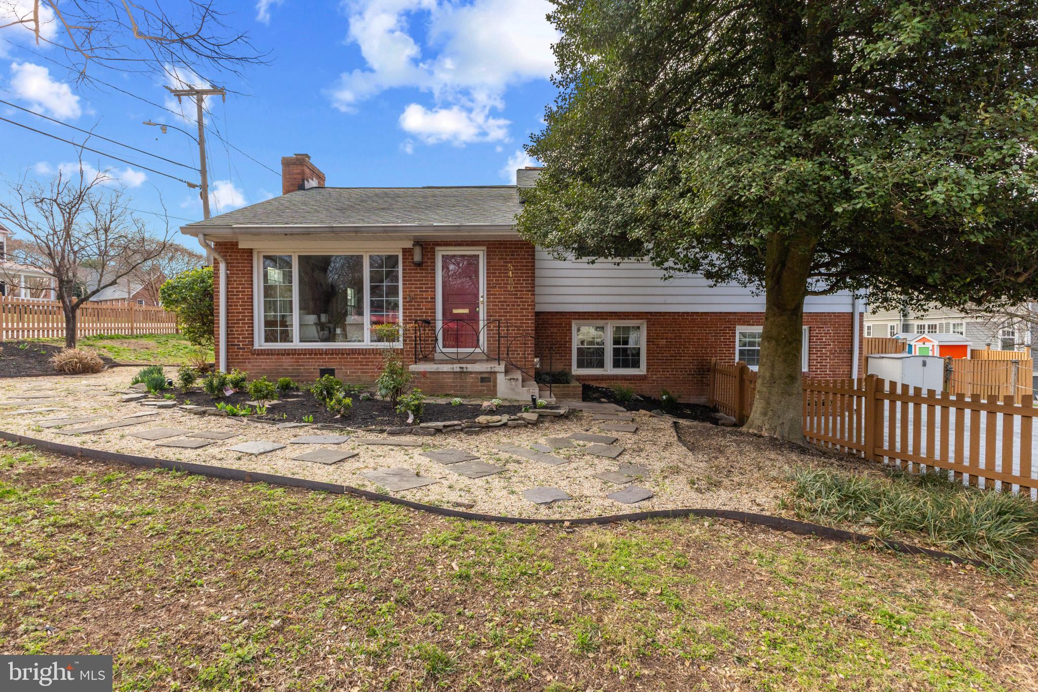 5400 27th Road North Arlington, VA 22207 - Photo 1 of 26 a view of a house with a small yard and floor to ceiling window
