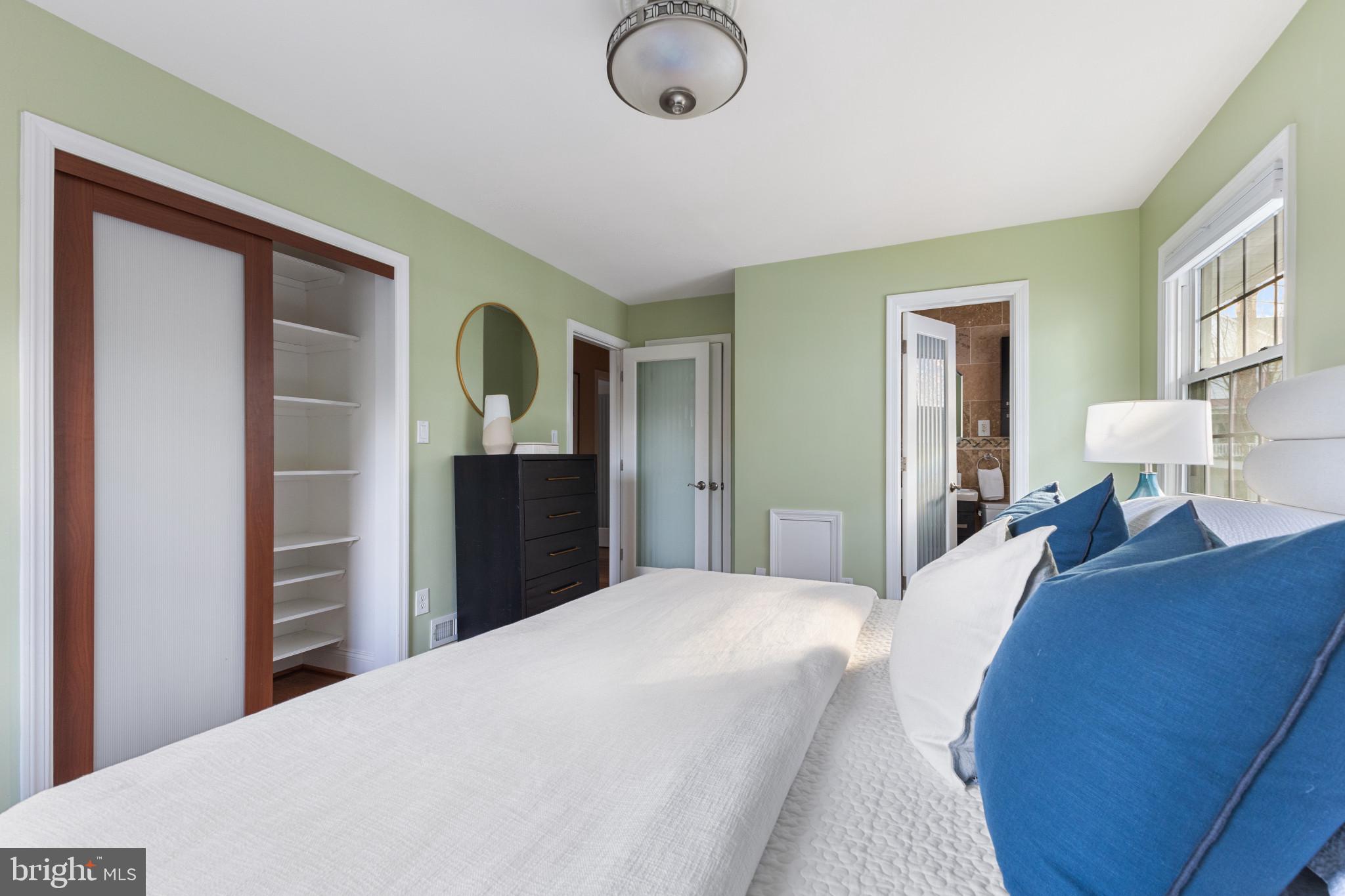 5400 27th Road North Arlington, VA 22207 - Photo 12 of 26 a bedroom with a bed and dresser with mirror