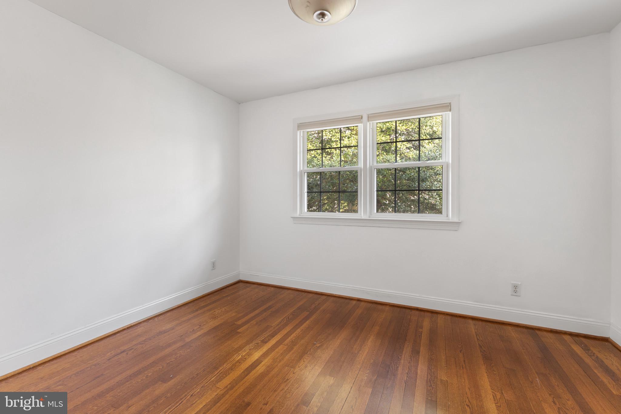 5400 27th Road North Arlington, VA 22207 - Photo 14 of 26 wooden floor in an empty room with a window