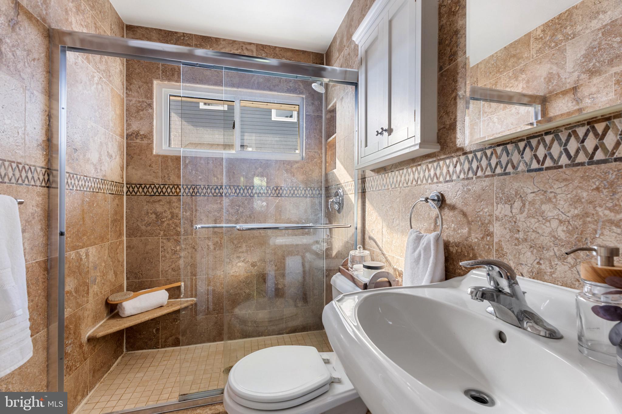 5400 27th Road North Arlington, VA 22207 - Photo 16 of 26 a bathroom with a sink toilet and shower