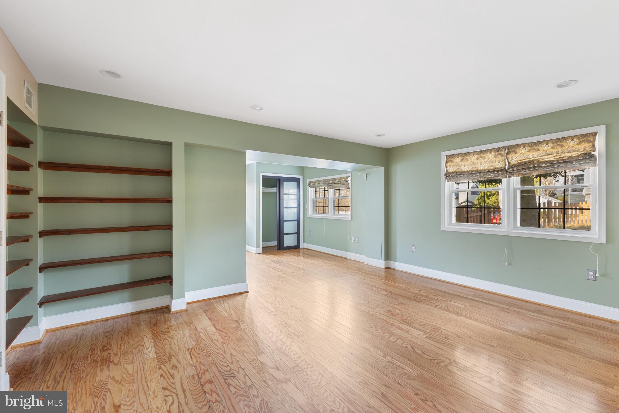 5400 27th Road North Arlington, VA 22207 - Photo 17 of 26 a view of an empty room with a window and wooden floor