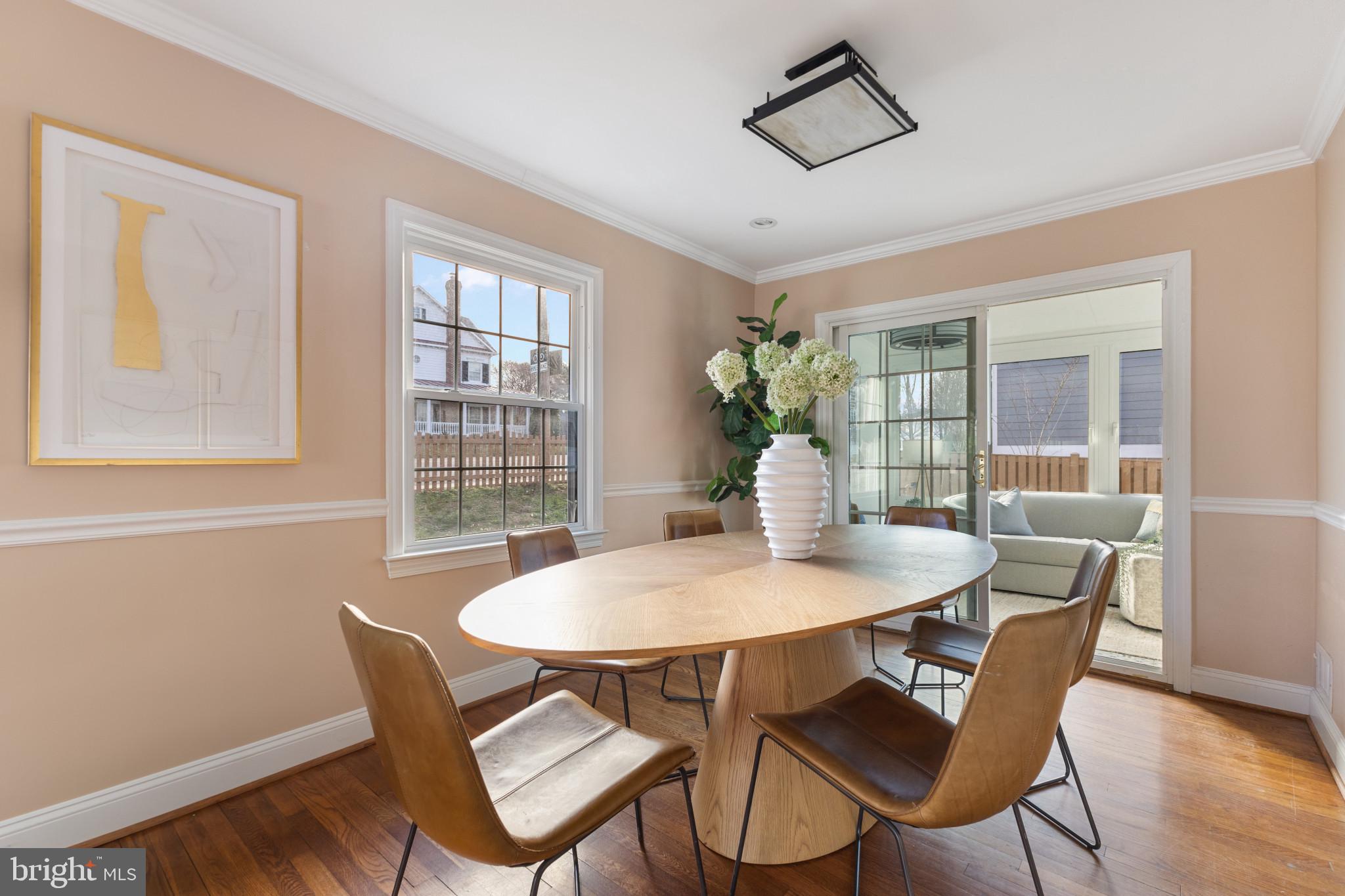5400 27th Road North Arlington, VA 22207 - Photo 8 of 26 a view of a dining room with furniture window and wooden floor